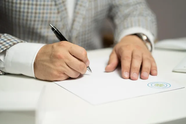 man, sign, paper, write, document, contract, signing, agreement, signature, signing document, signing contract, signing paper, sign, contract, contract, contract, contract, contract, signing, agreement, signature, signature. Scotland and Wales devolved policy for UGC campaigns